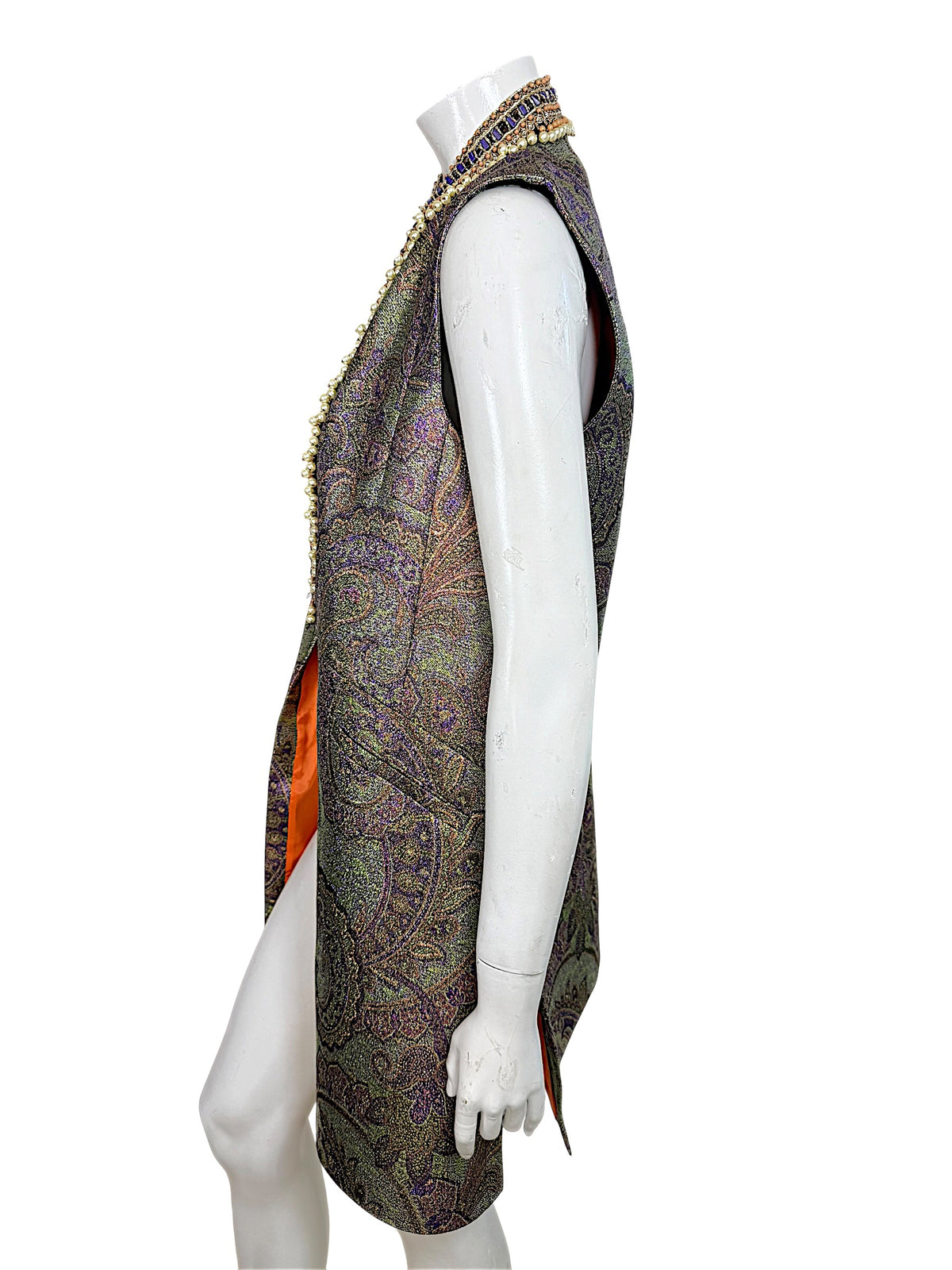 Opposite side view of Etro metallic paisley longline vest highlighting its open-front construction, sleeveless cut and orange lining.