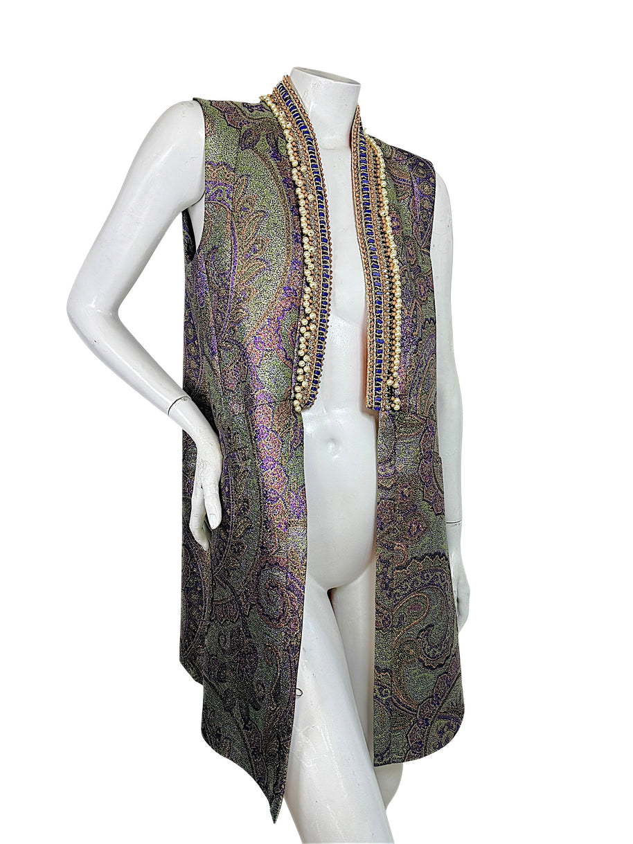 Etro Italian designer sleeveless longline vest in metallic paisley jacquard with ornate beaded collar, photographed at a three-quarter angle.