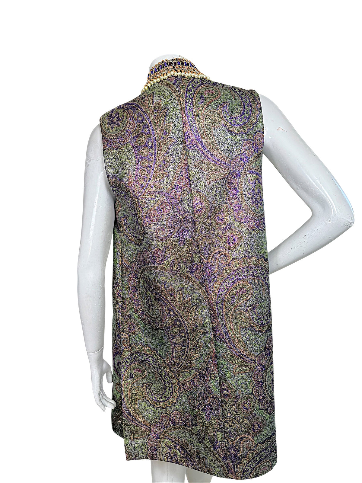Close-up of Etro vest back showing intricate metallic paisley jacquard weave and raised collar with faux pearls and purple beading.