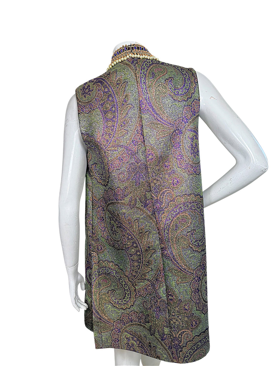 Close-up of Etro vest back showing intricate metallic paisley jacquard weave and raised collar with faux pearls and purple beading.
