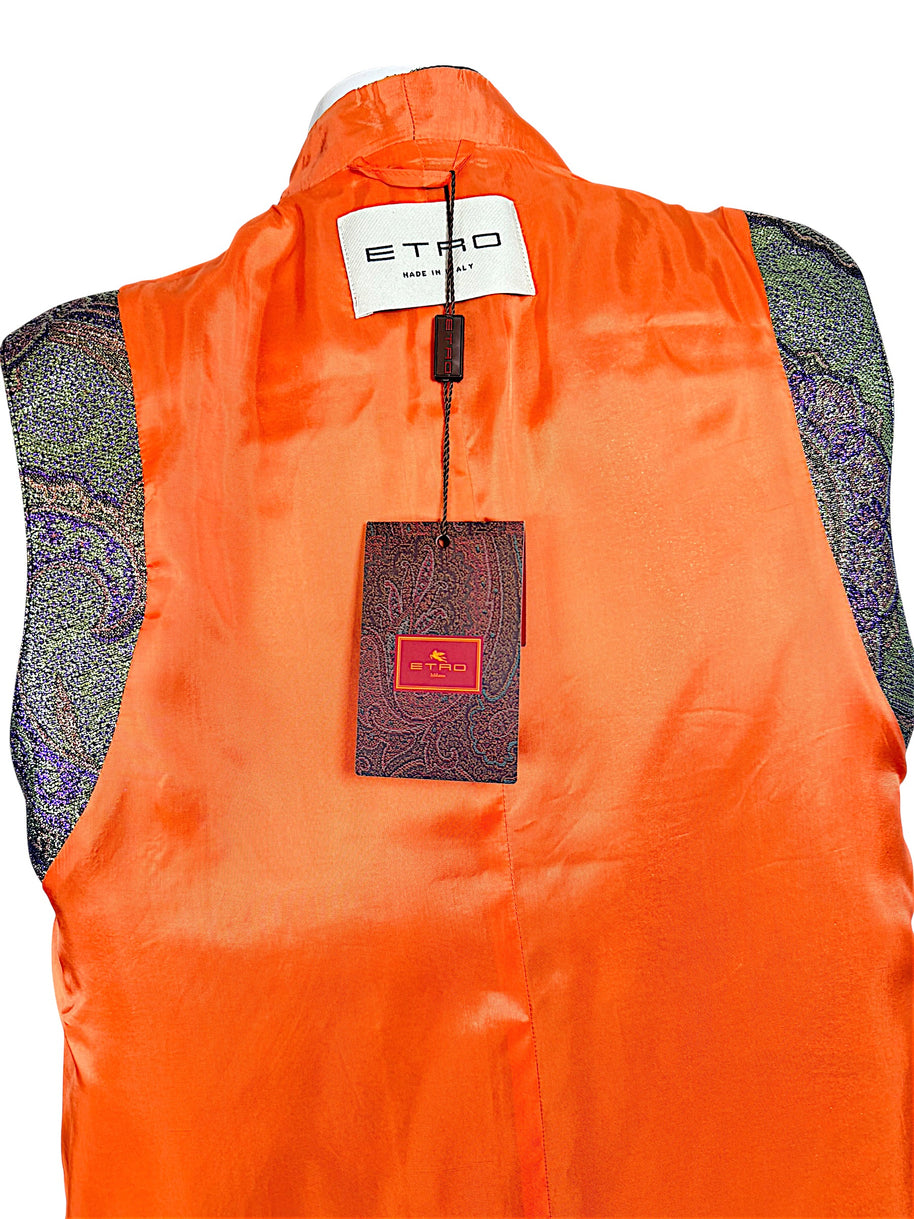 Close-up of Etro Made in Italy designer label and original paisley-patterned retail hangtag against bright orange vest lining.