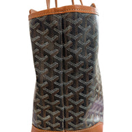 Left profile side view of authentic Goyard Artois PM tote featuring structured leather corners and Goyardine canvas.