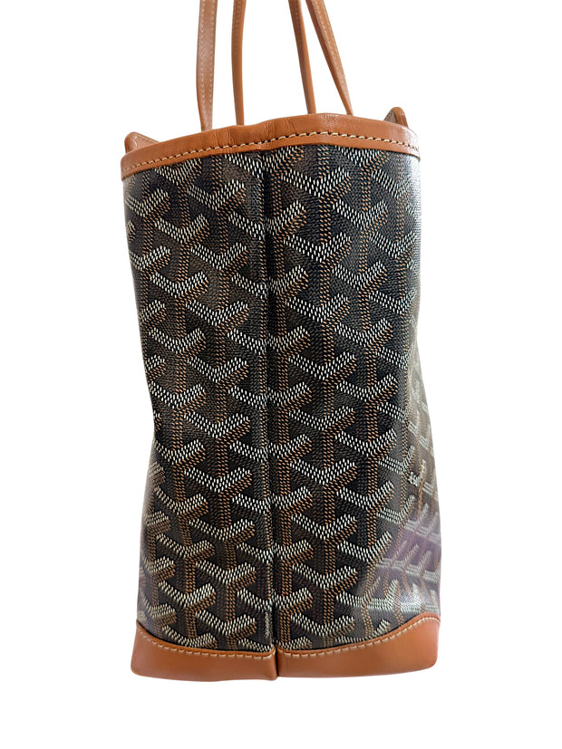 Left profile side view of authentic Goyard Artois PM tote featuring structured leather corners and Goyardine canvas.