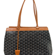 Authentic Goyard Artois PM tote handbag in black Goyardine canvas with tan leather trim front exterior view.