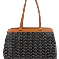 Rear exterior view of authentic Goyard Artois PM tote in black Goyardine canvas with tan leather trim.