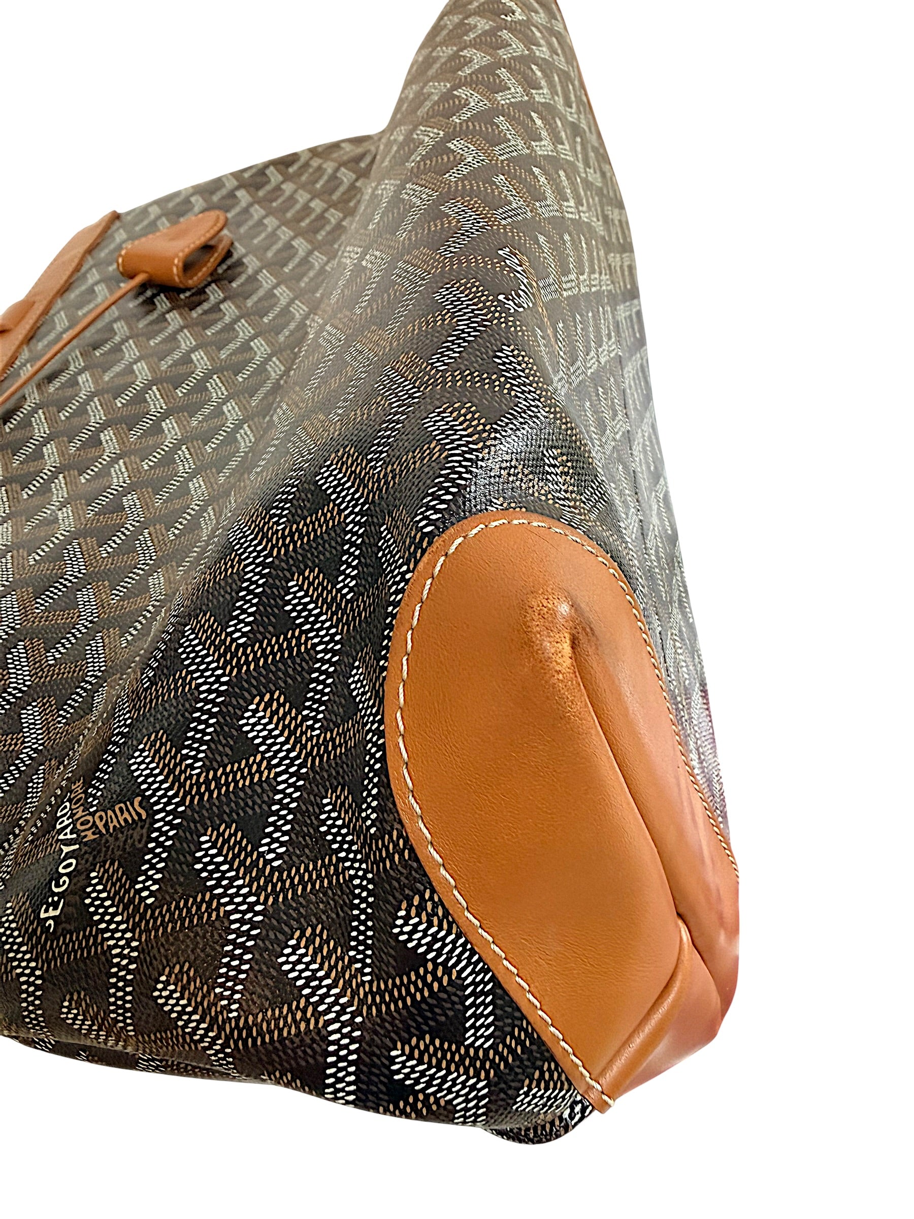 Close-up corner wear detail of authentic Goyard Artois PM showing light leather rubbing consistent with use.