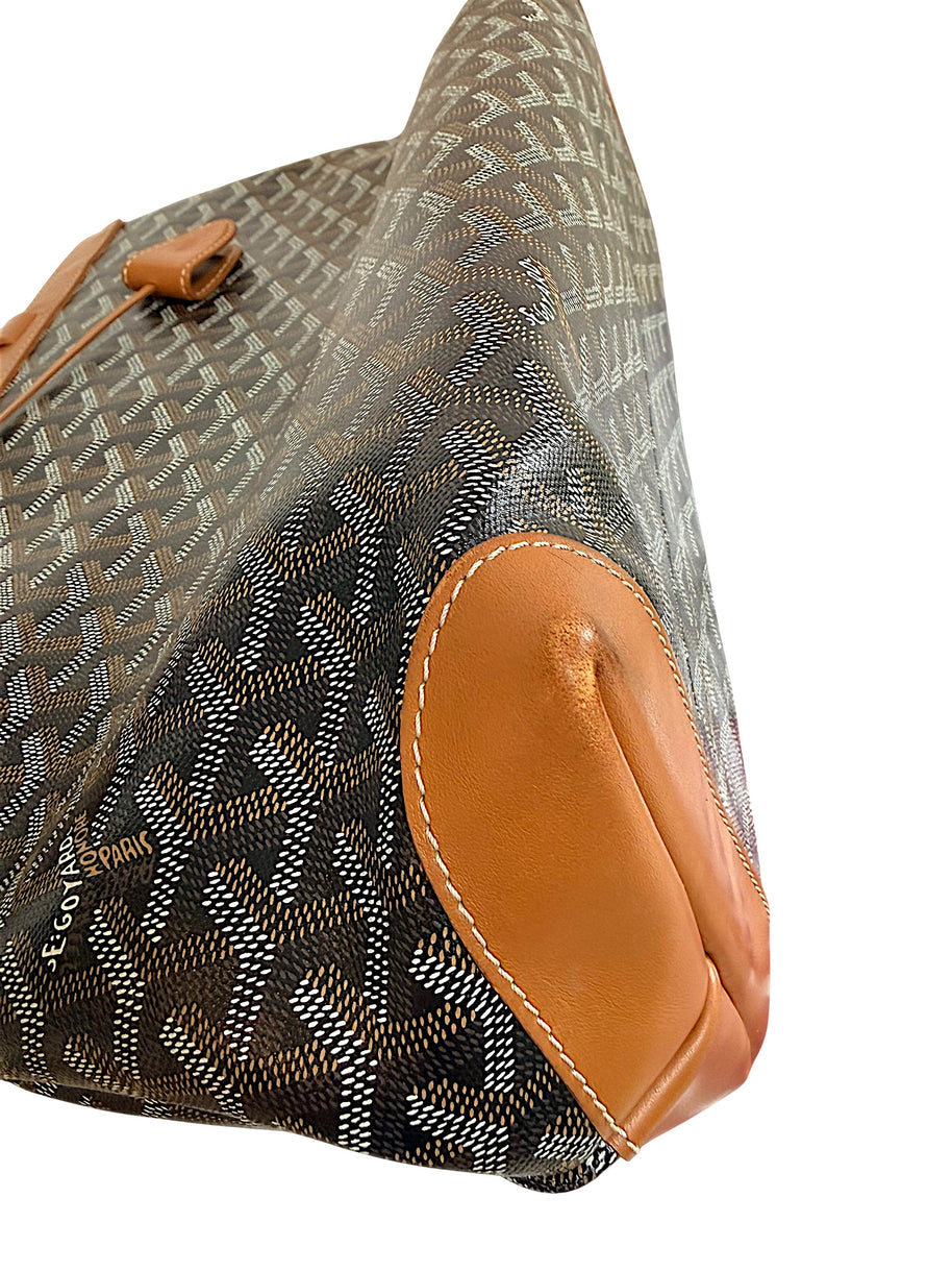 Close-up corner wear detail of authentic Goyard Artois PM showing light leather rubbing consistent with use.