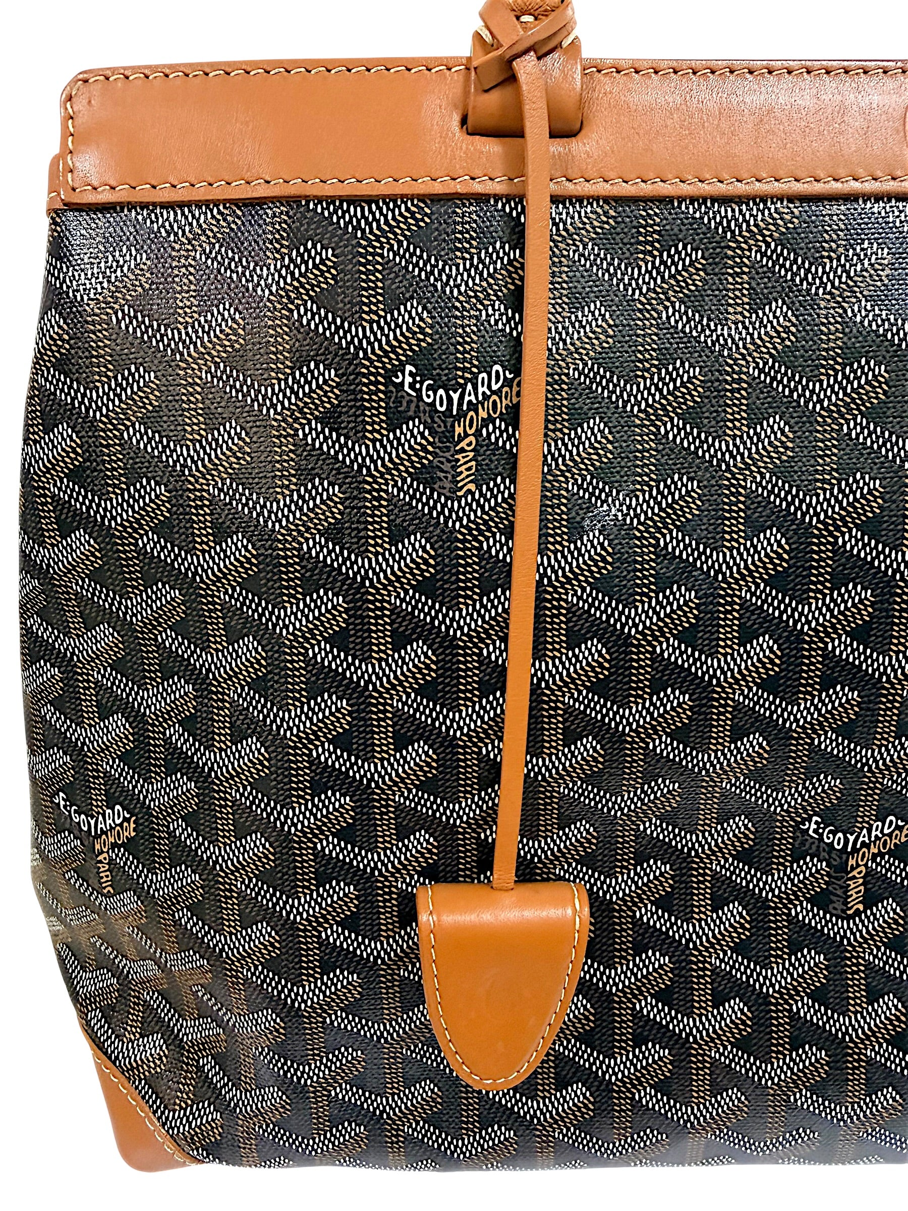 Front exterior view of authentic Goyard Artois PM with leather clochette and signature Goyardine pattern.