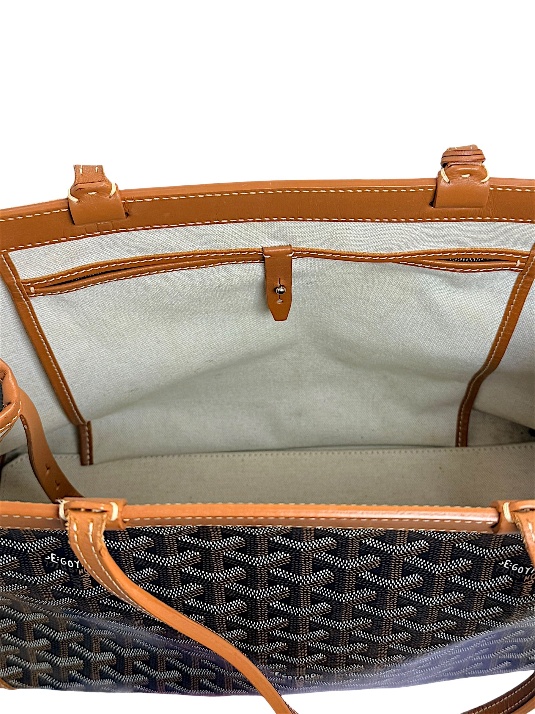 Open top view of authentic Goyard Artois PM tote showing leather trim and structured silhouette.