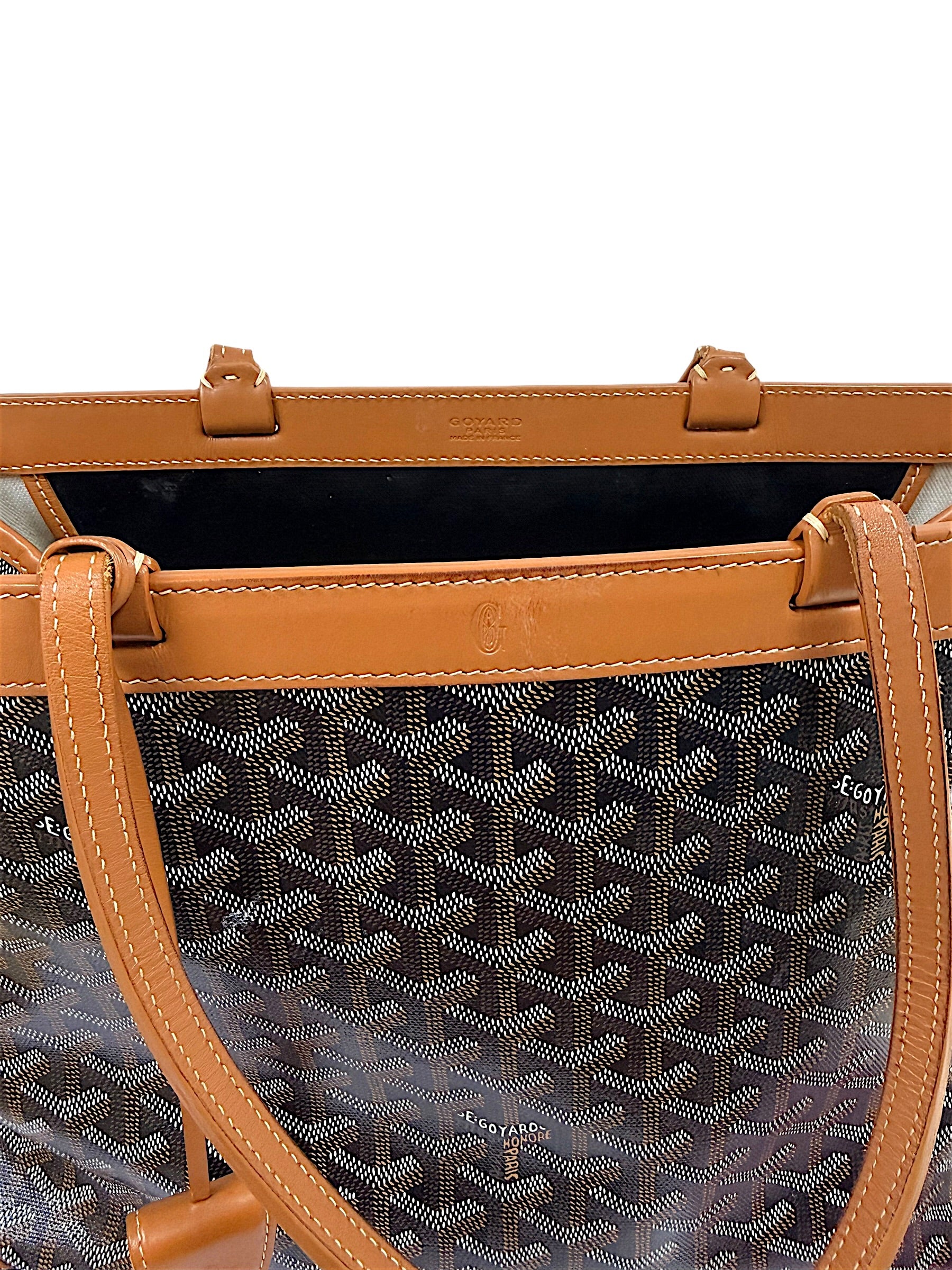 Top leather trim and handle detail view of authentic Goyard Artois PM tote.