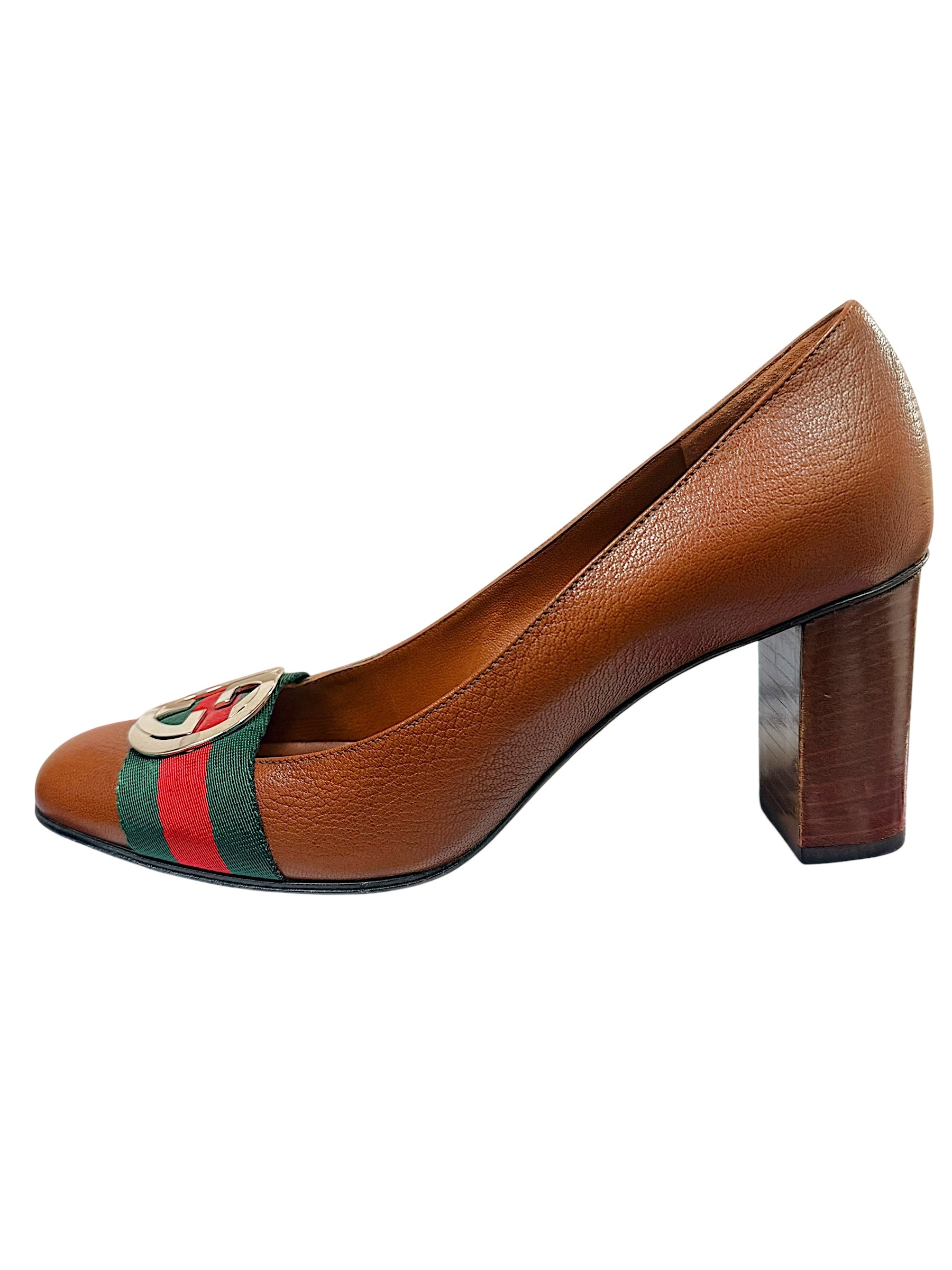 Left side profile of Gucci brown leather pumps with green and red Web stripe detail and block heel.