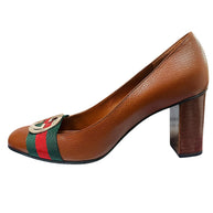 Left side profile of Gucci brown leather pumps with green and red Web stripe detail and block heel.