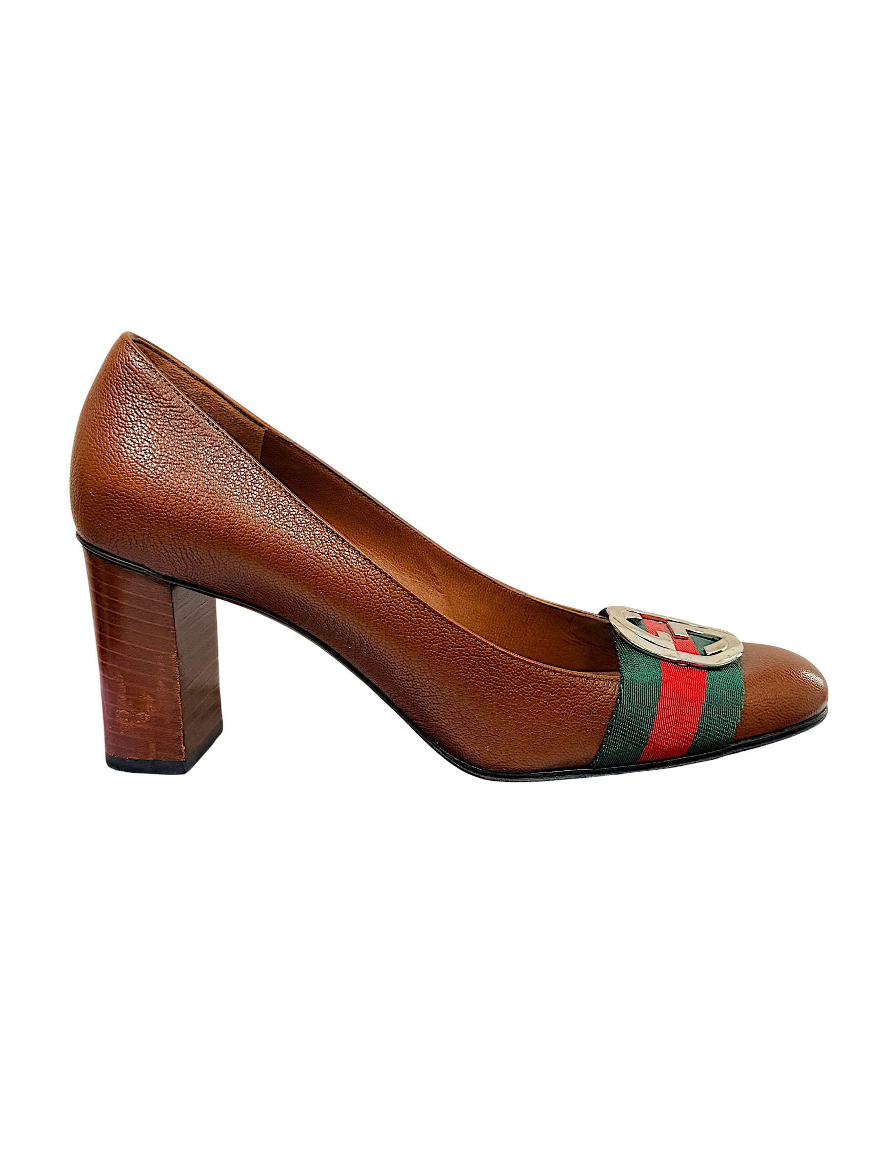Right side profile of Gucci brown leather Gucci pumps featuring GG hardware and stacked block heel.
