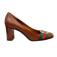 Right side profile of Gucci brown leather Gucci pumps featuring GG hardware and stacked block heel.