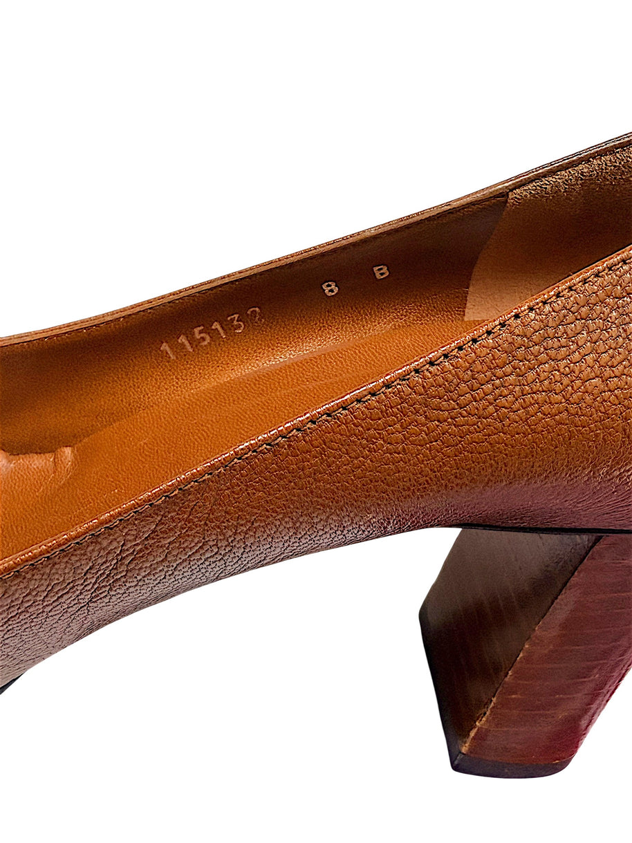 Interior close-up of authentic Gucci pumps displaying EU 38B sizing and leather lining.