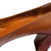 Interior close-up of authentic Gucci pumps displaying EU 38B sizing and leather lining.