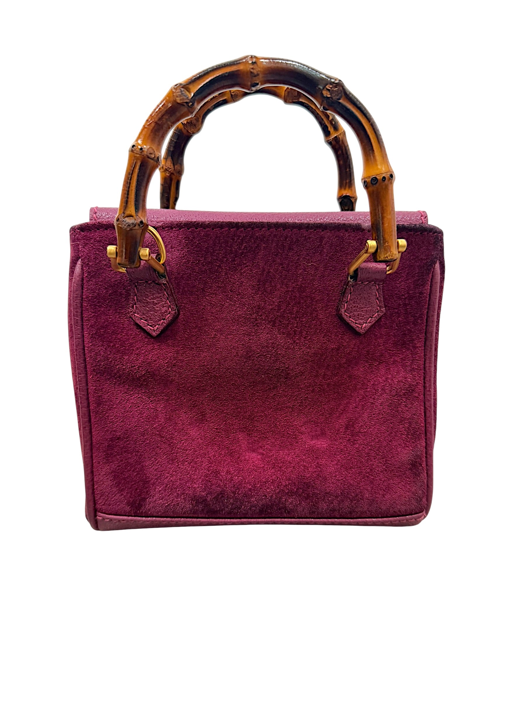 Back view of Gucci mini bamboo suede bag in magenta