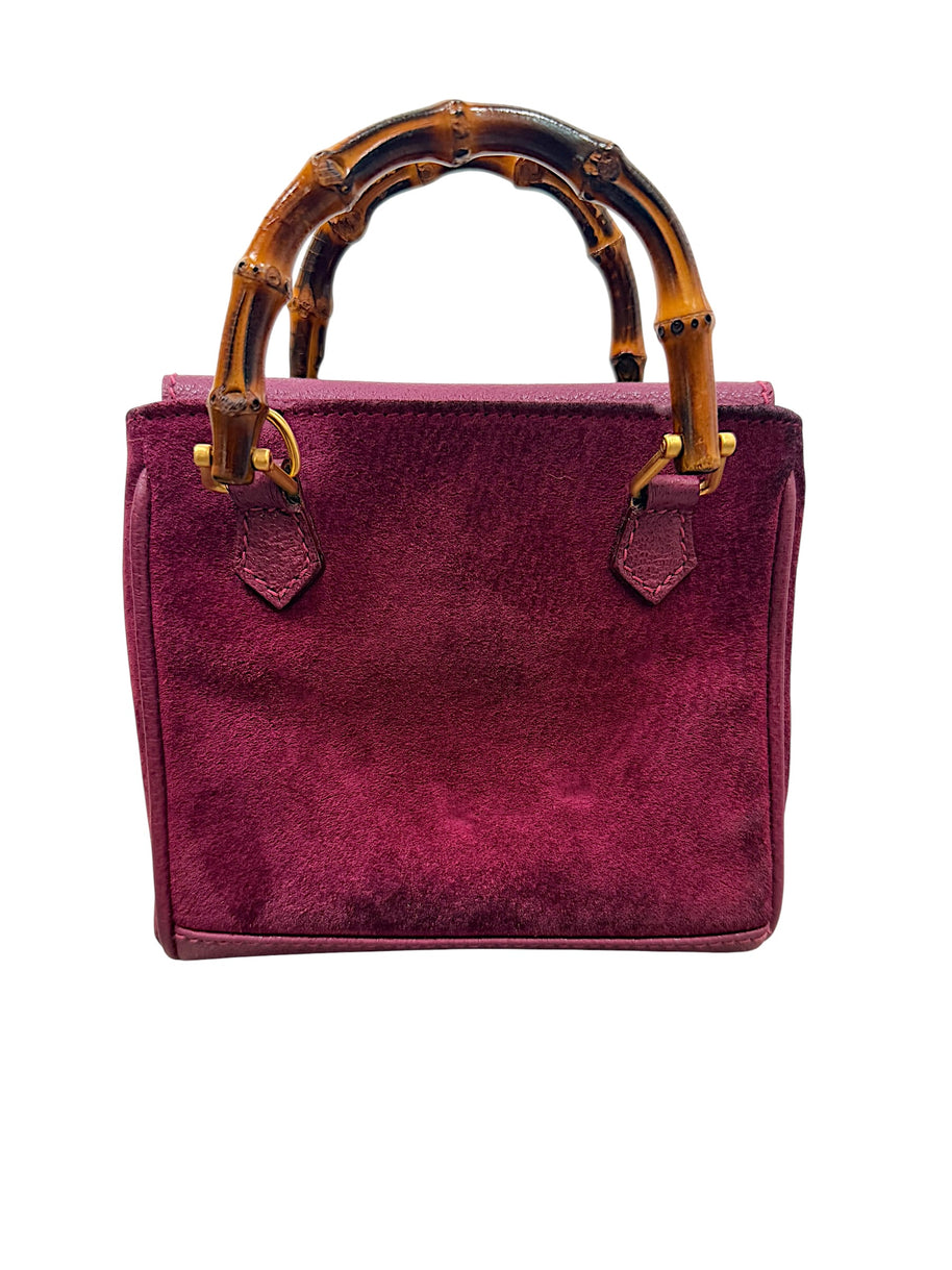 Back view of Gucci mini bamboo suede bag in magenta