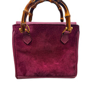 Back view of Gucci mini bamboo suede bag in magenta