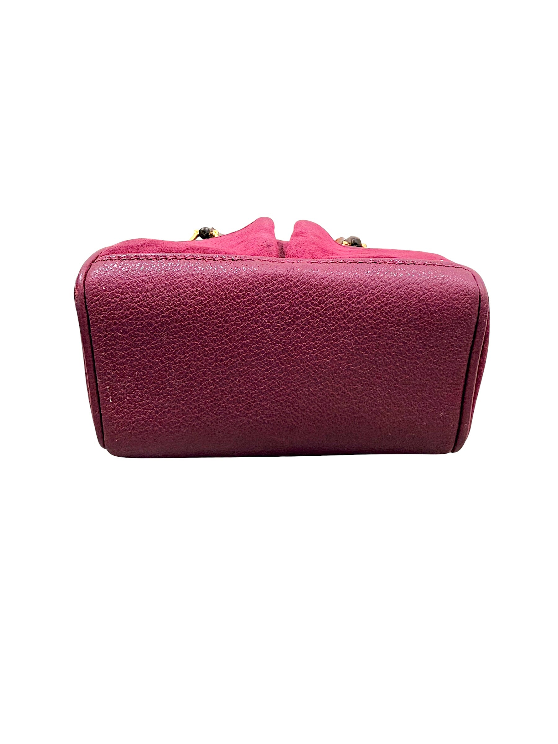 Bottom base view of Gucci magenta suede bamboo handbag