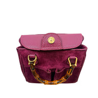 Gucci suede bamboo bag with flap closure open showing interior