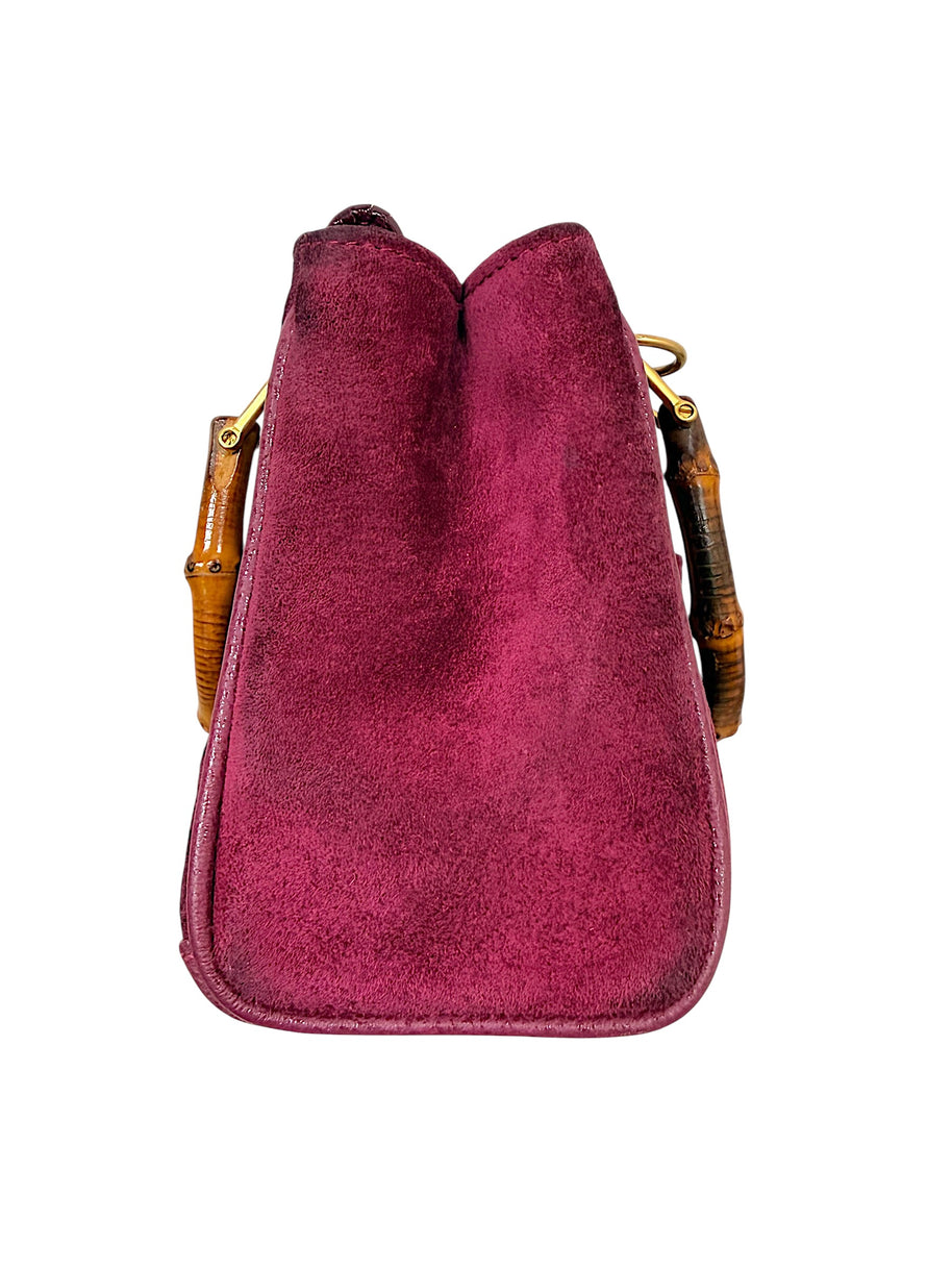 Right side profile of vintage Gucci suede bamboo handbag