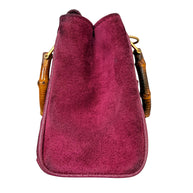 Right side profile of vintage Gucci suede bamboo handbag