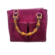 Top view of Gucci bamboo handle suede mini handbag