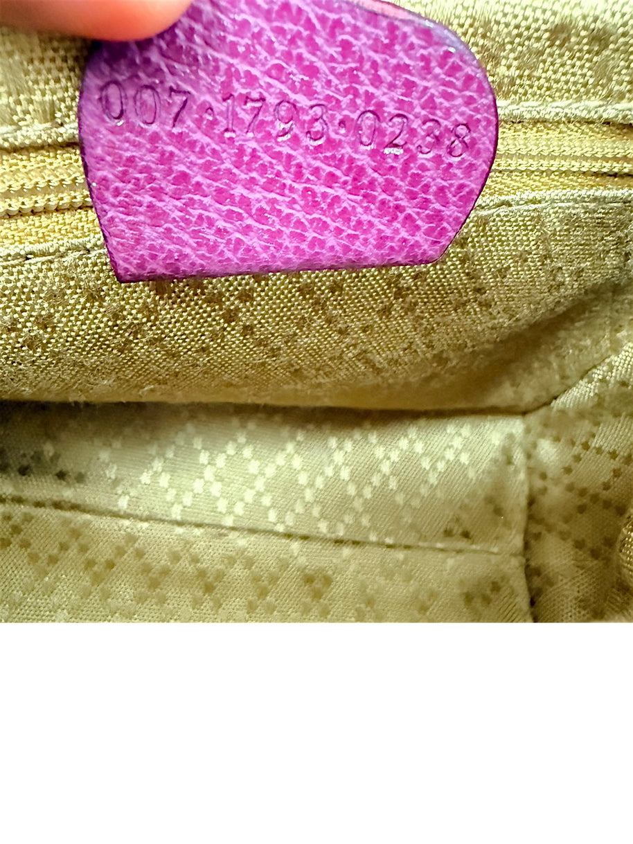 Gucci serial number interior leather tag close-up