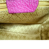 Gucci serial number interior leather tag close-up