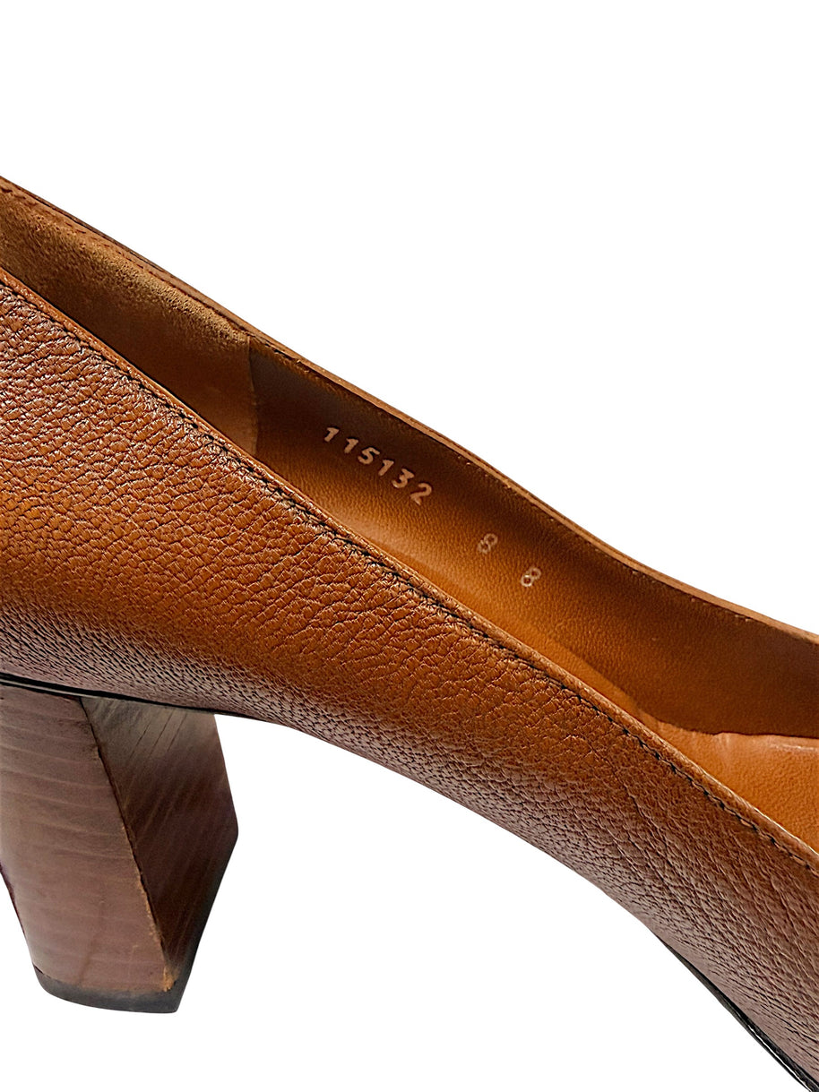 Close-up interior view showing Gucci size marking EU 38B and pebbled brown leather construction.