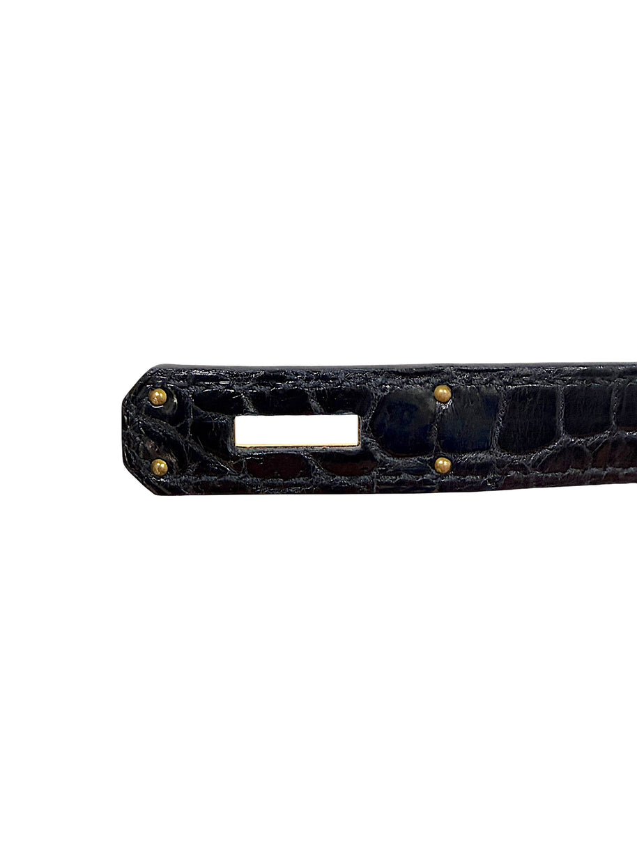 Detail of Hermès Birkin black crocodile sangles strap and hardware