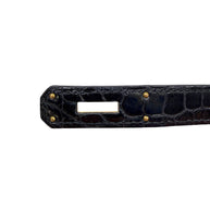 Detail of Hermès Birkin black crocodile sangles strap and hardware