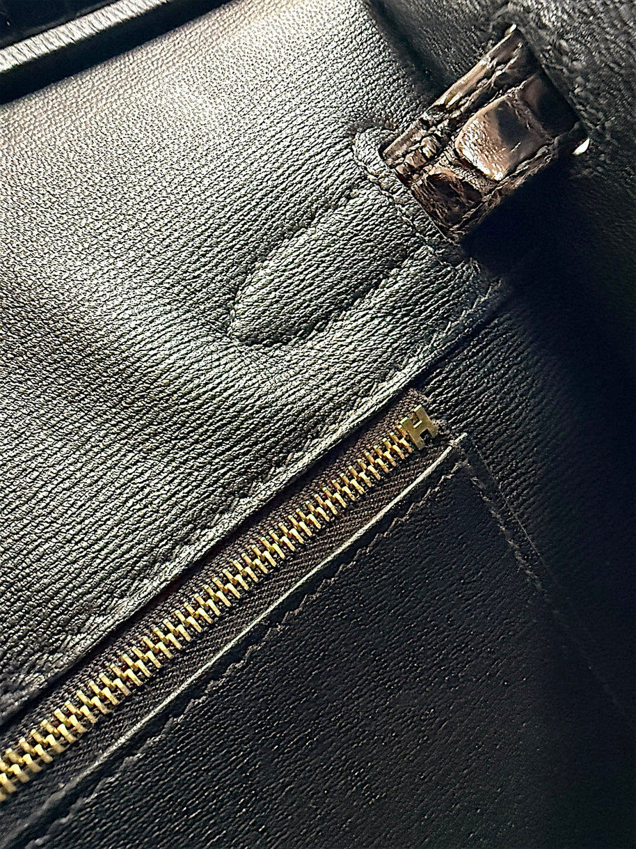 Detailed interior zip pocket and black leather lining inside Hermès Birkin 30 Sellier crocodile handbag