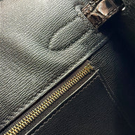 Detailed interior zip pocket and black leather lining inside Hermès Birkin 30 Sellier crocodile handbag