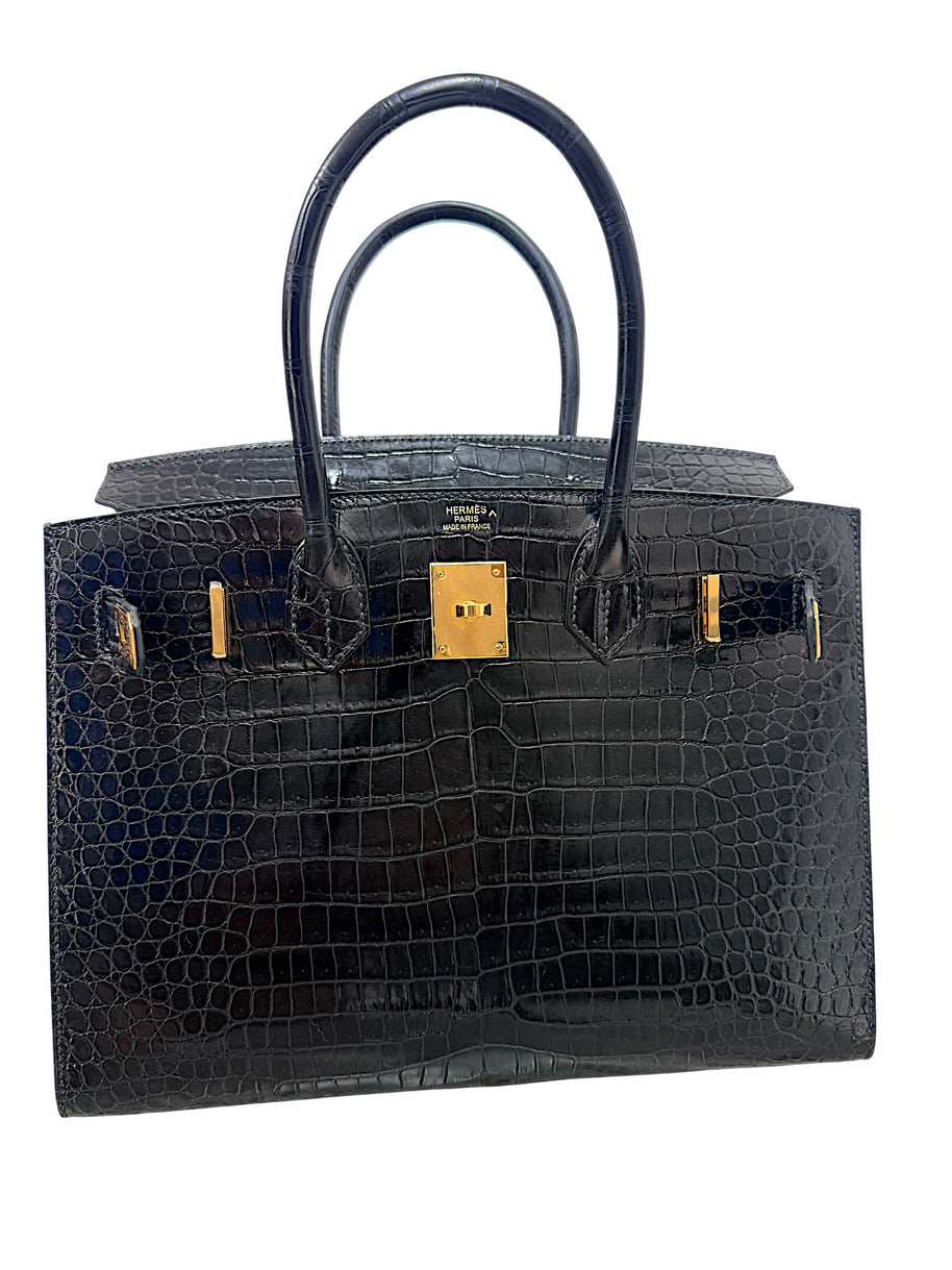 Interior view of Hermès Birkin 30 crocodile handbag with gold hardware