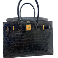 Interior view of Hermès Birkin 30 crocodile handbag with gold hardware
