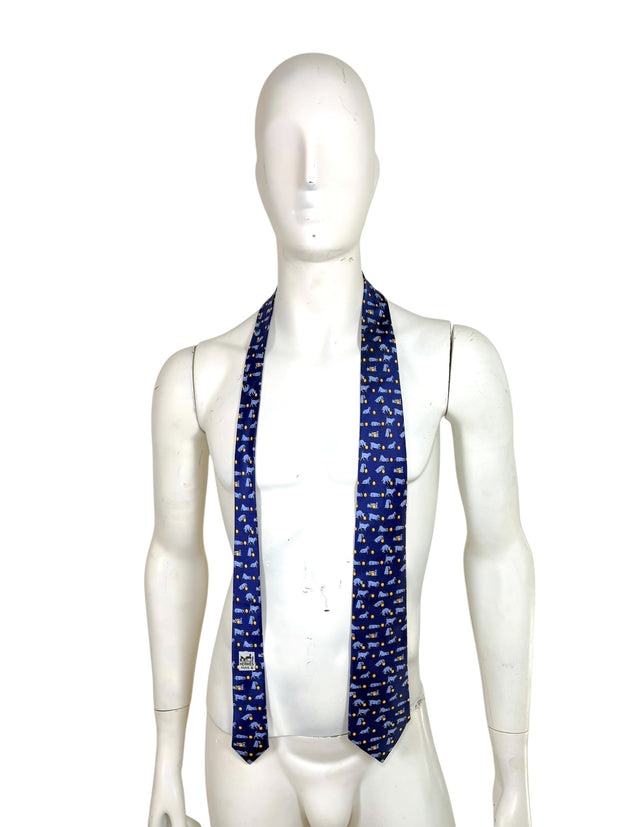 Hermès blue silk men’s tie with dog print shown full length on mannequin