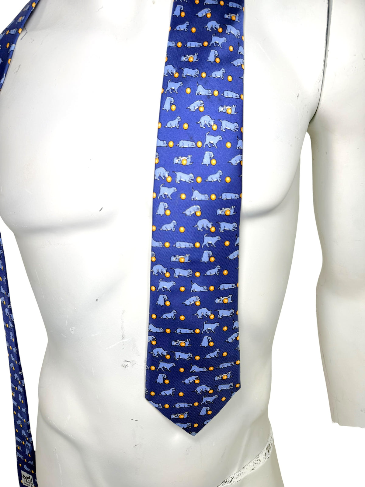 Hermès blue silk tie dog print pattern and upper tie detail