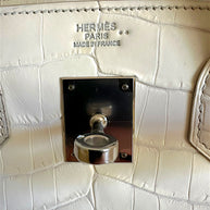 Close-up Hermès Paris Made in France embossing and palladium turnlock hardware detail on Himalaya Birkin 30.