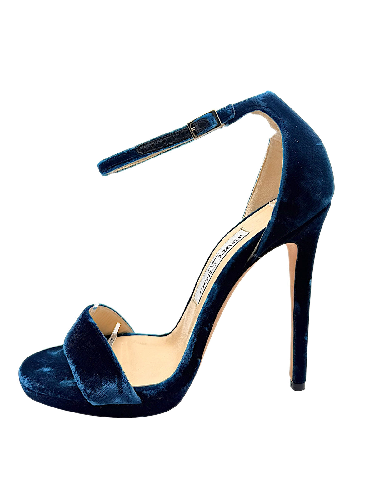 Underside of Jimmy Choo Misty 120 teal velvet heels showing original leather soles, EU 39 size markings and visible scuffing from previous wear.