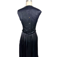Full back view of Lanvin Hiver 2005 black satin dress featuring covered button closures and softly pleated skirt.