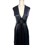 Front full view of Lanvin Hiver 2005 black satin sleeveless dress with plunging neckline, pleated skirt, and tonal rosette waist detail on mannequin.