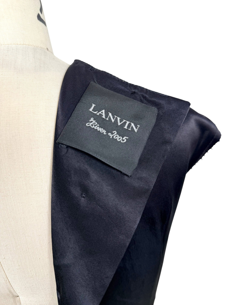 Close-up image of Lanvin Hiver 2005 label attached to black satin archival designer dress.
