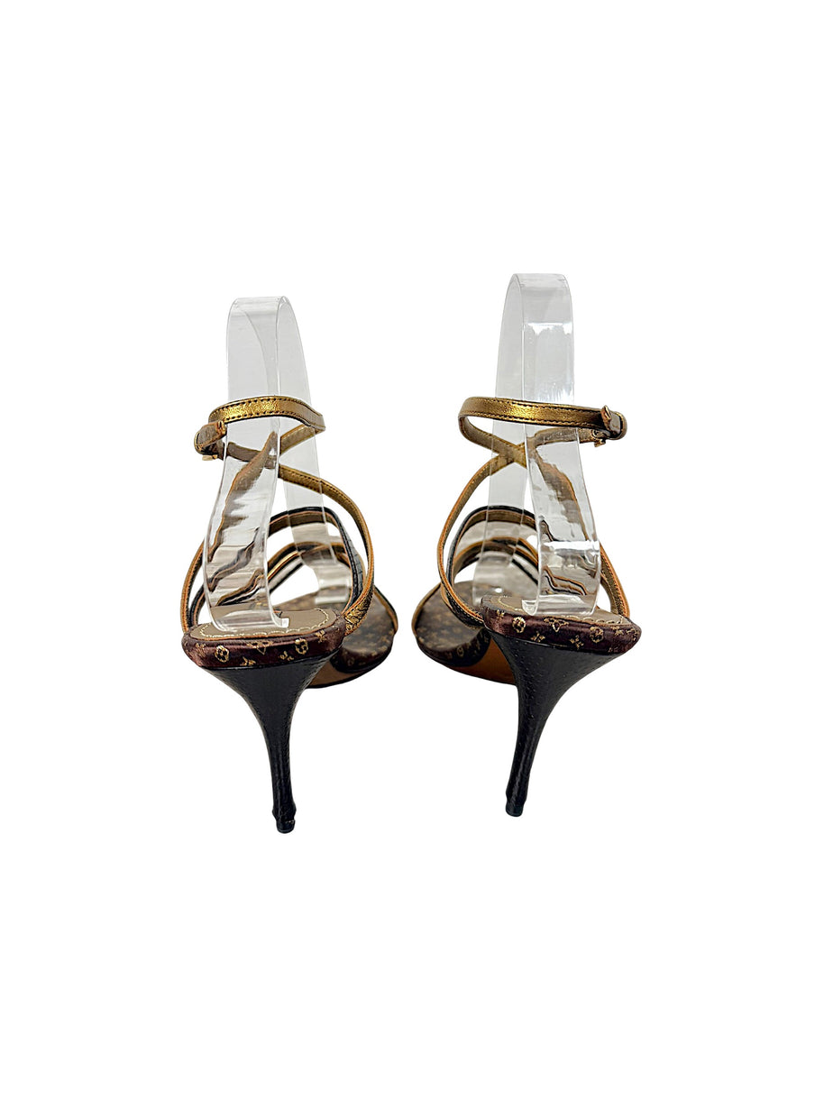 Rear view of Louis Vuitton vintage Monogram strappy sandals showing slim dark brown stiletto heels and ankle straps