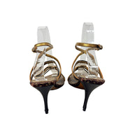 Rear view of Louis Vuitton vintage Monogram strappy sandals showing slim dark brown stiletto heels and ankle straps