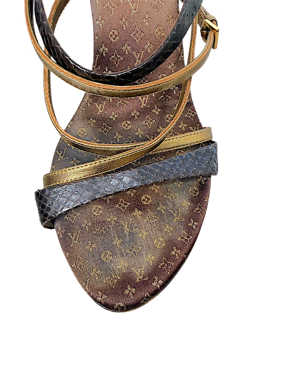 Close-up of Louis Vuitton vintage Monogram sandal showing brown and gold footbed, metallic gold straps and dark textured toe strap