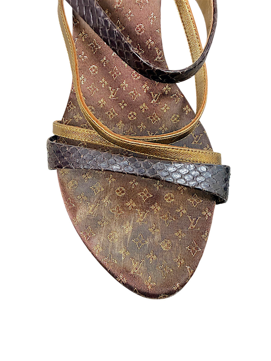 Close-up of Louis Vuitton Monogram sandal toe showing metallic gold leather and dark textured strap detailing