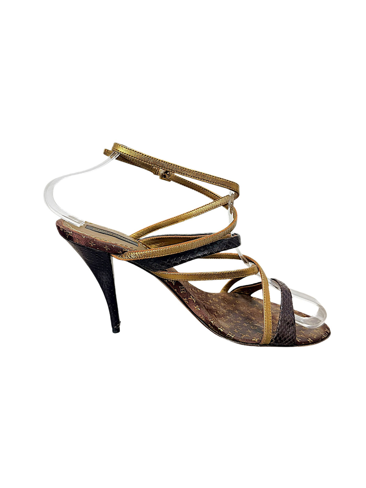 Side profile of Louis Vuitton vintage brown Monogram and metallic gold strappy stiletto sandal