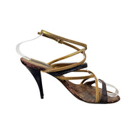 Side profile of Louis Vuitton vintage brown Monogram and metallic gold strappy stiletto sandal